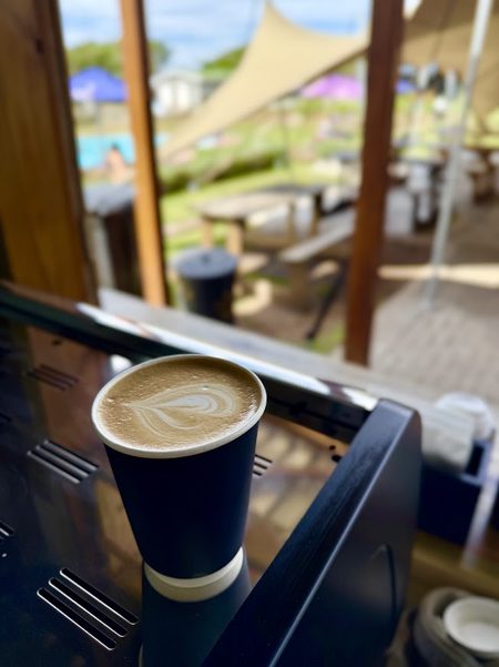 A flat white at Yellow's Bru, overlooking the pool