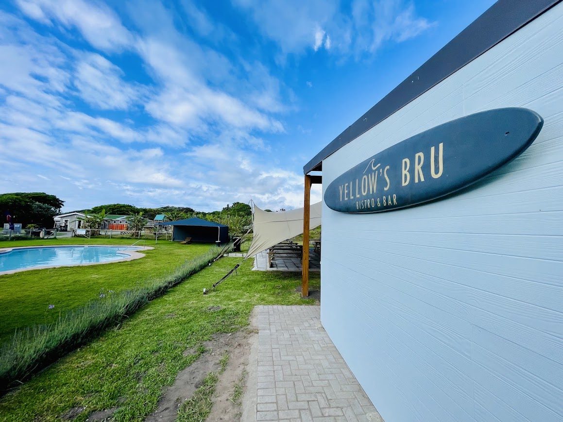 Yellow's Bru Bistro & Bar, with the stretch tent and resort pool alongside